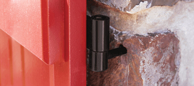 Closeup photo of shutter lag pintels installed on red board and batten shutter.