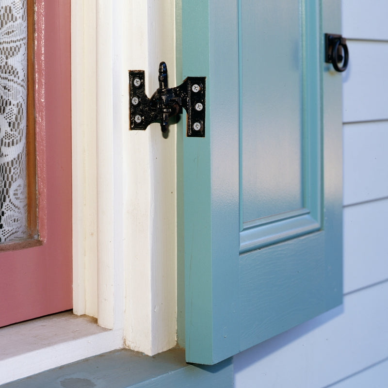 Closeup of Lull & Porter (Acme) Mortise Hinges installed on light blue panel shutter.