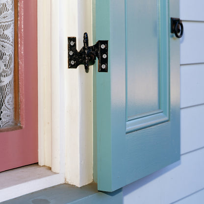 Closeup of Lull & Porter (Acme) Mortise Hinges installed on light blue panel shutter.