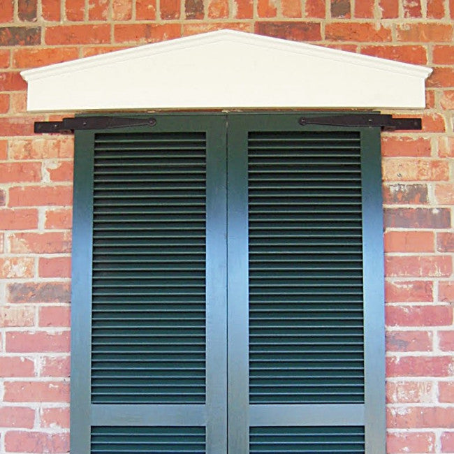 Closeup of Heavy Duty Brick Mount Pintel with black powder coating installed on closed black shutters.