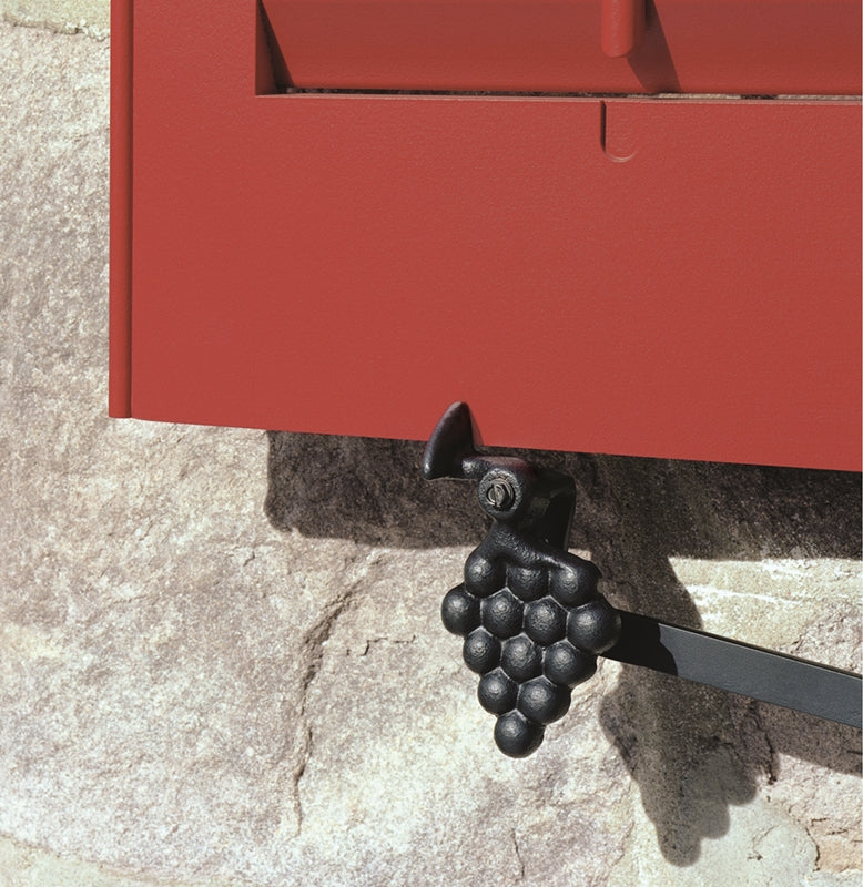 Closeup of Sill Mount Vintage Grape Shutter Tieback with black powder coating installed on red operable louver shutter.