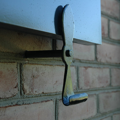 Closeup of Lag Mount Belmont Shutter Tiebacks with black powder coating installed on blue shutter.