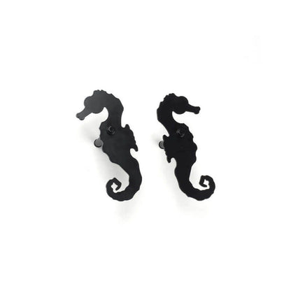 Closeup of Plate Mount Sea Horse Shutter Tiebacks with black powder coating.