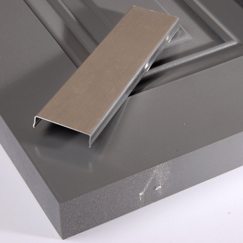 Closeup of Aluminum Shutter Capping on top of gray raised panel shutter.